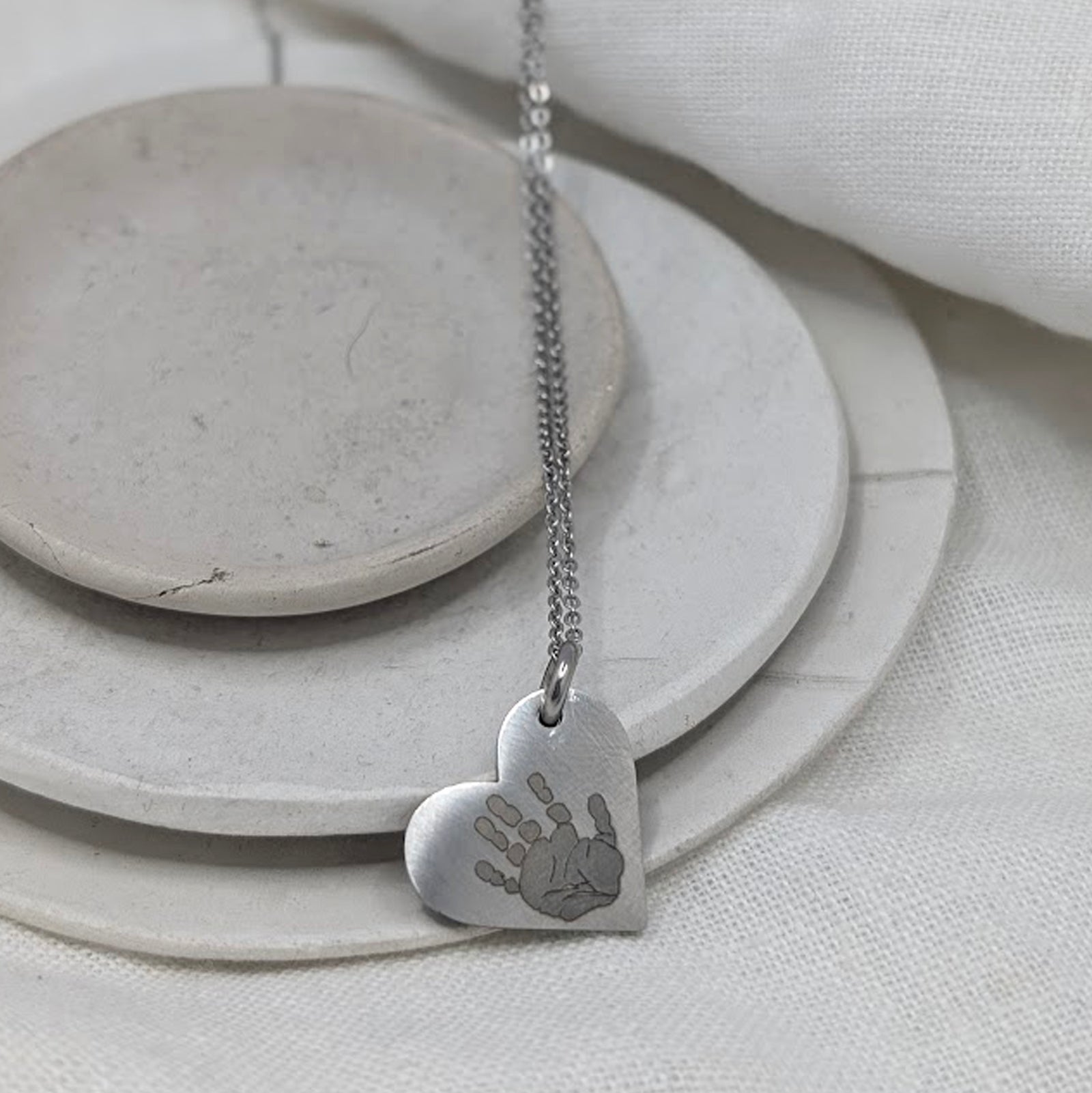 HANDPRINT STEEL HEART NECKLACE