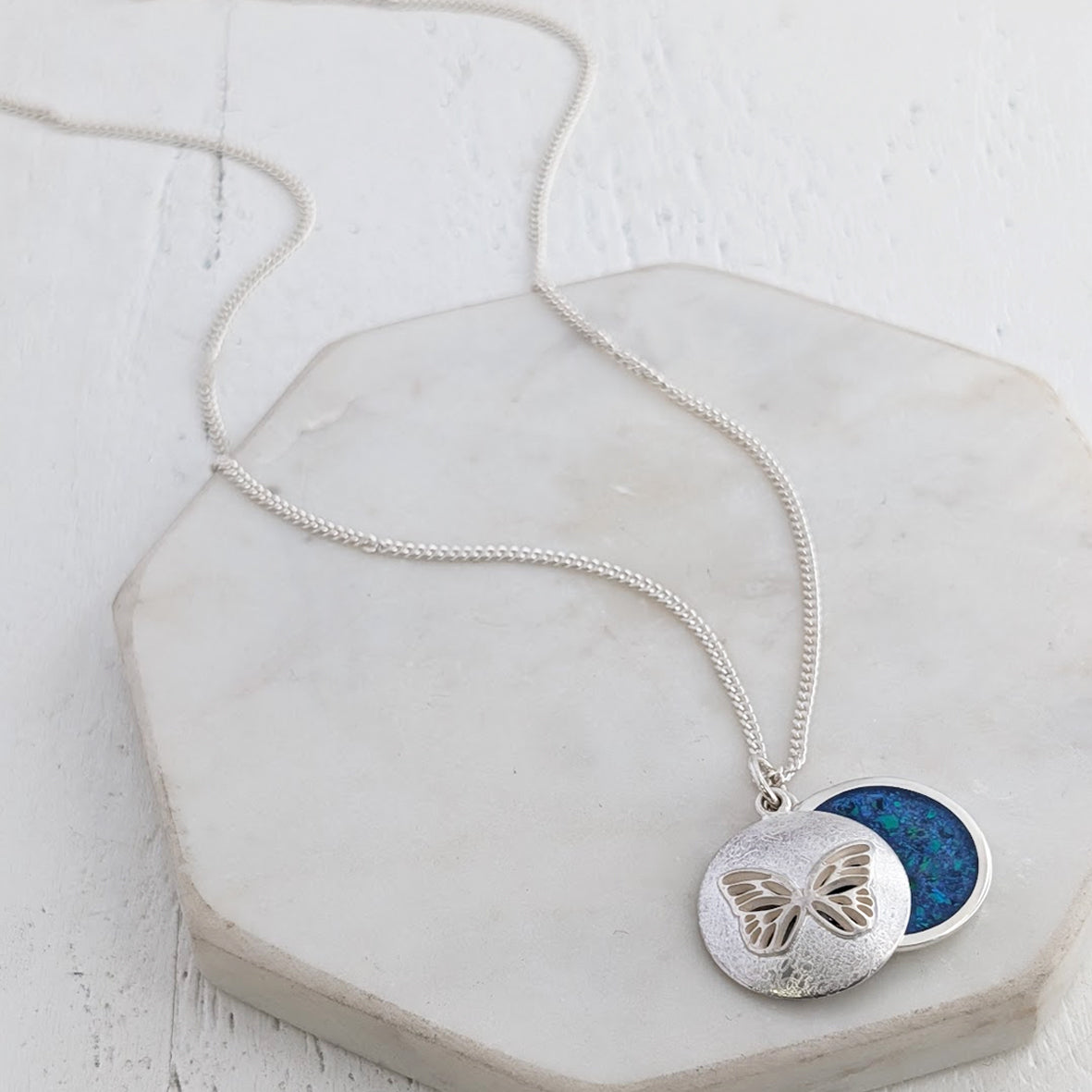 Cremation ashes memorial necklace handmade from sterling silver featuring a butterfly