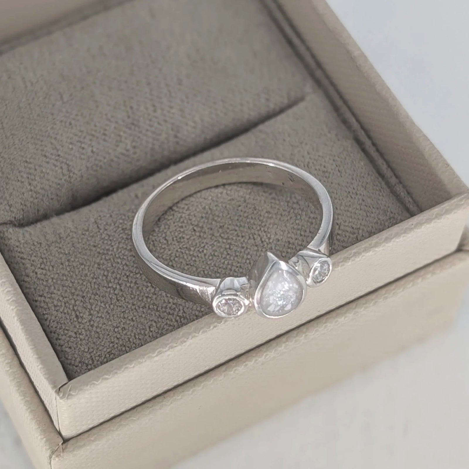 Cremation ashes jewellery ring with teardrop ashes setting and cubic zirconia accents
