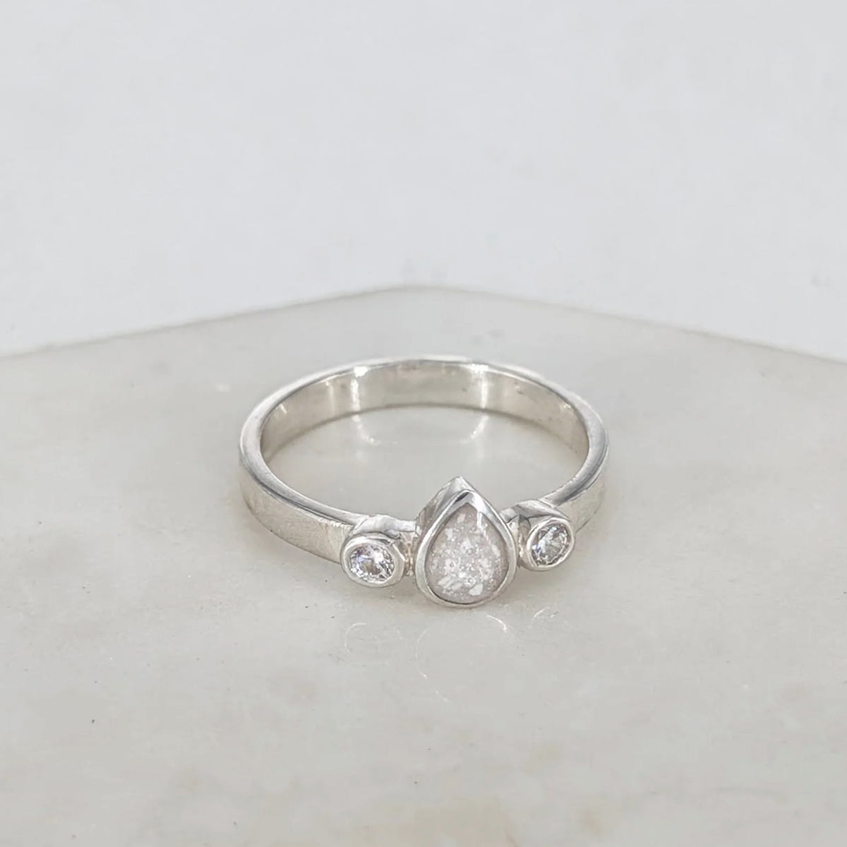 Sterling silver memorial ring for a loved one’s ashes with teardrop centre design