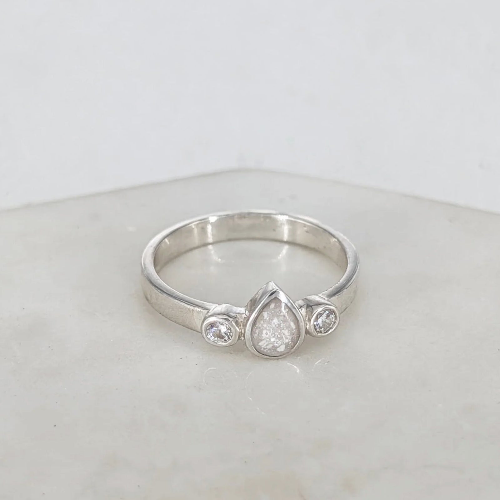 Sterling silver memorial ring for a loved one’s ashes with teardrop centre design