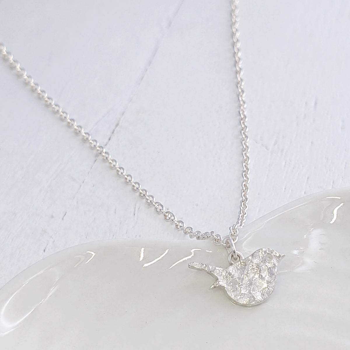 memorial jewellery textrued with cremation ashes