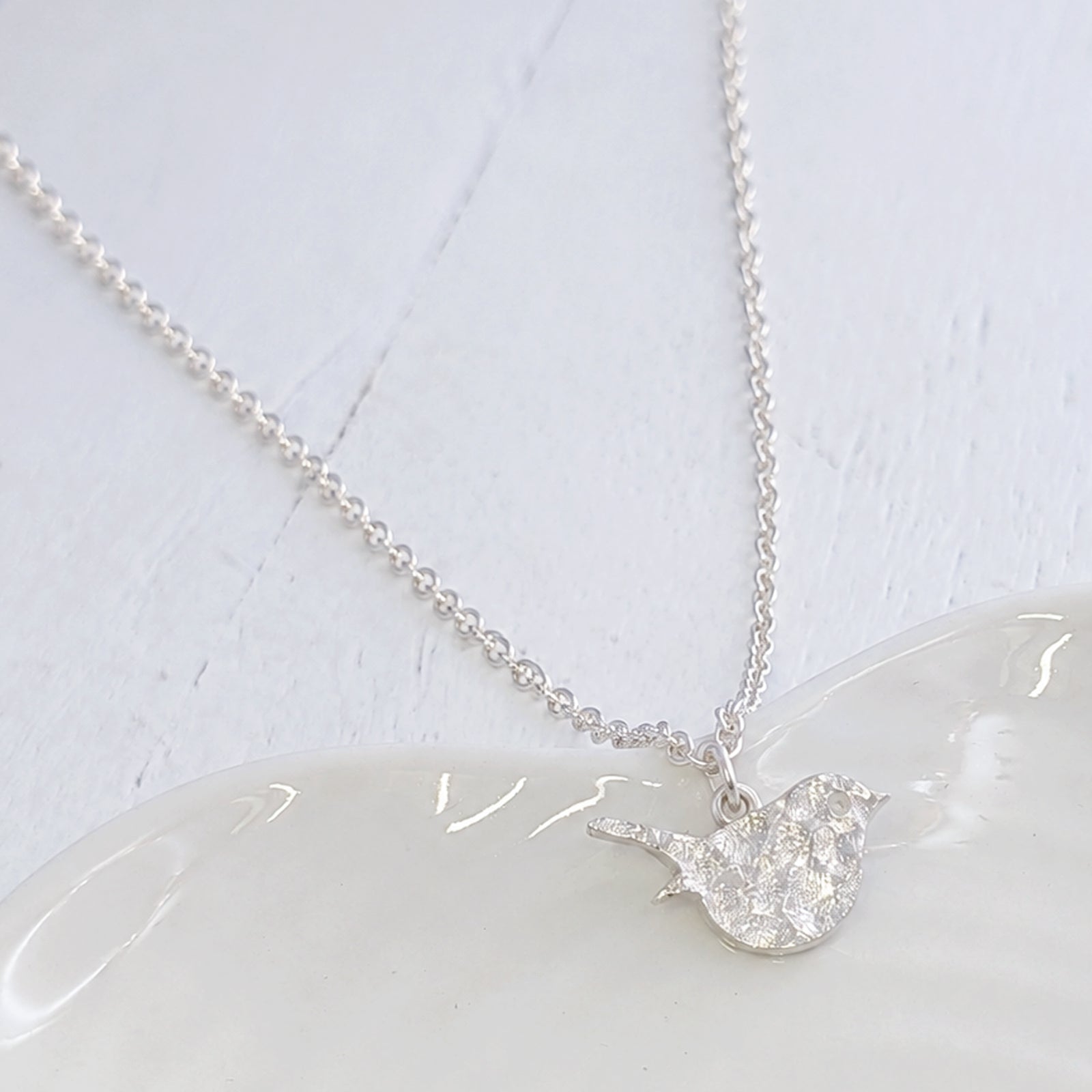 memorial jewellery textrued with cremation ashes
