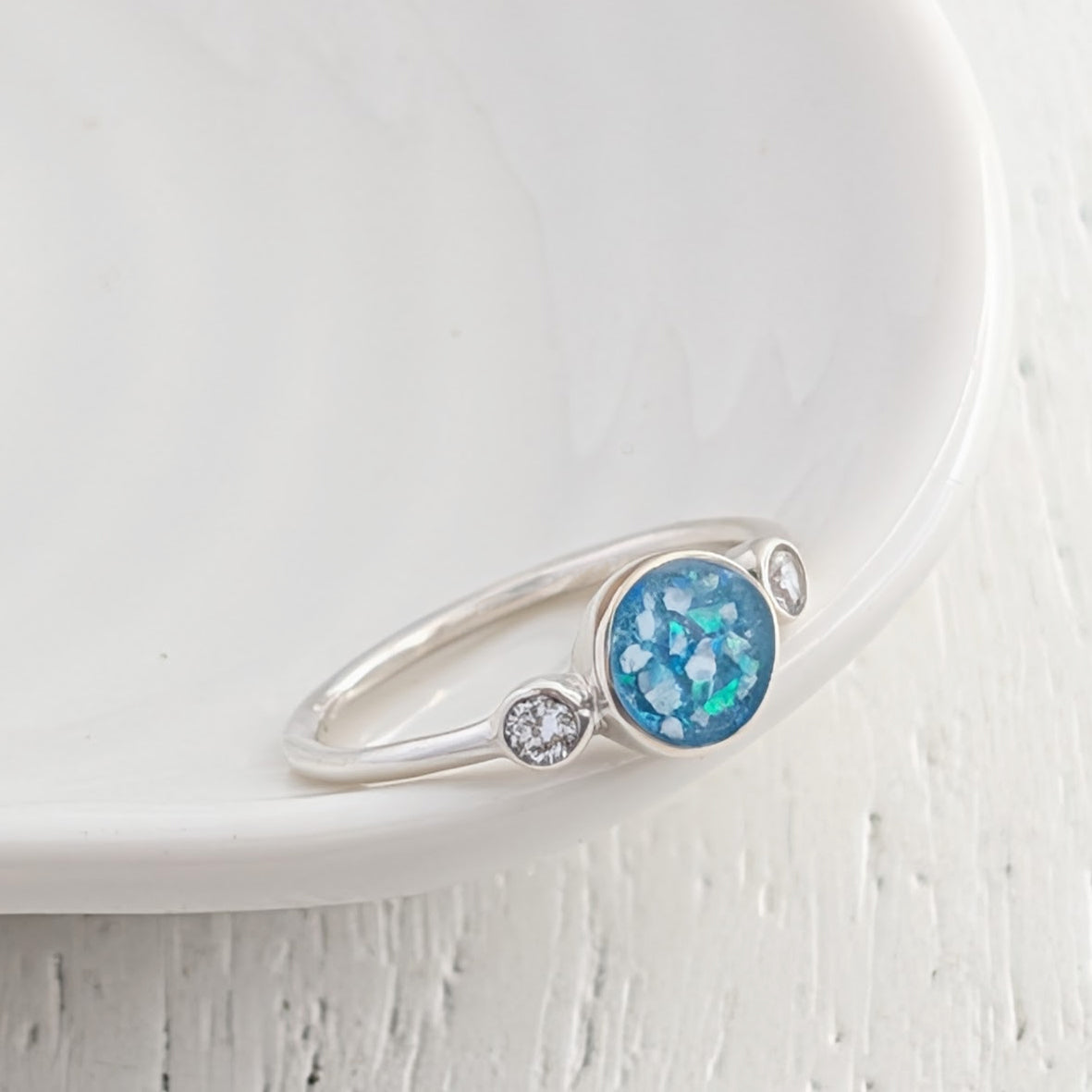 Cremation ashes set in  silver ring with gemstones