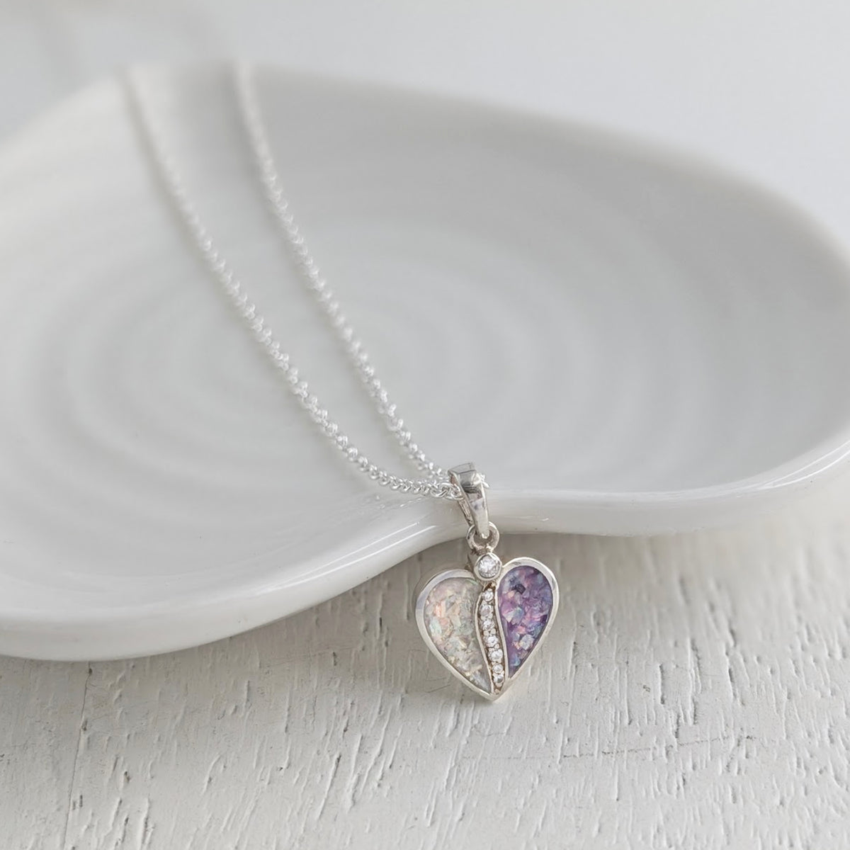 Sterling silver Together memorial ashes necklace with two coloured opal heart sections and sparkling cubic zirconia stones