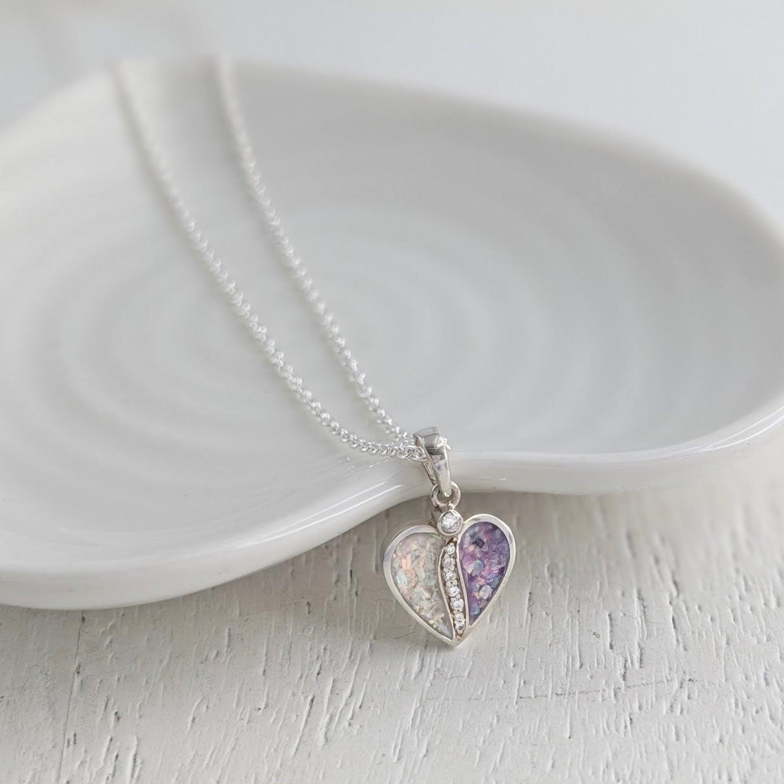 Sterling silver Together memorial ashes necklace with two coloured opal heart sections and sparkling cubic zirconia stones