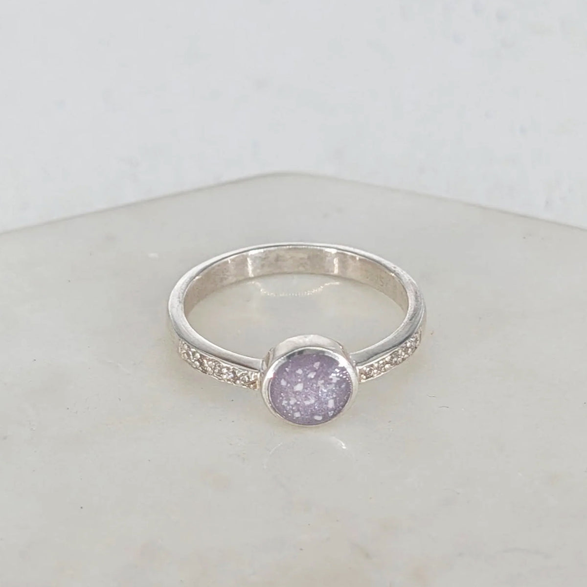 Sterling silver memorial ring for a loved one’s cremation ashes with delicate CZ detail