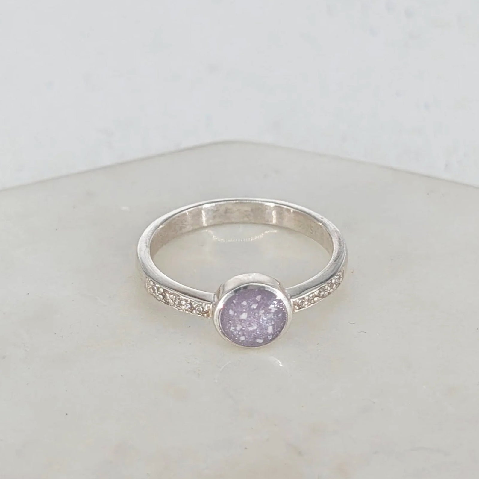 Sterling silver memorial ring for a loved one’s cremation ashes with delicate CZ detail