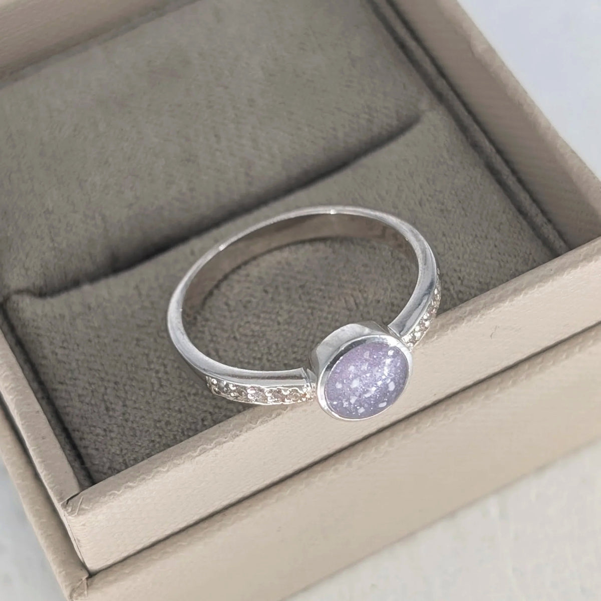 Sterling silver cremation ashes ring with round memorial setting and cubic zirconia detail