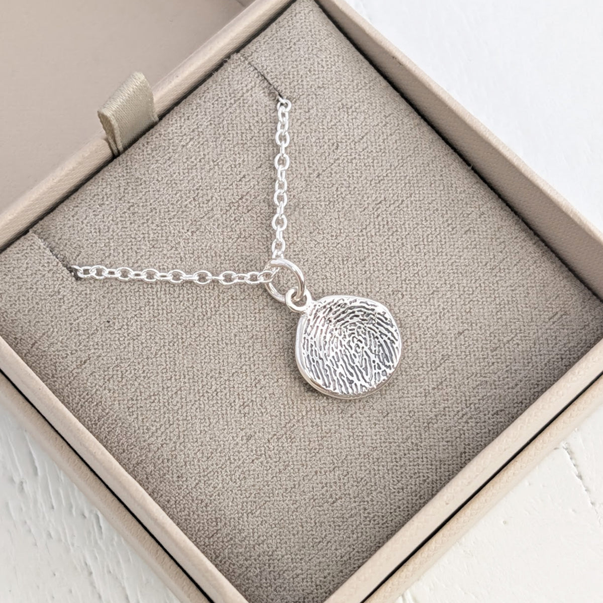 MOLTEN FINGERPRINT CHARM