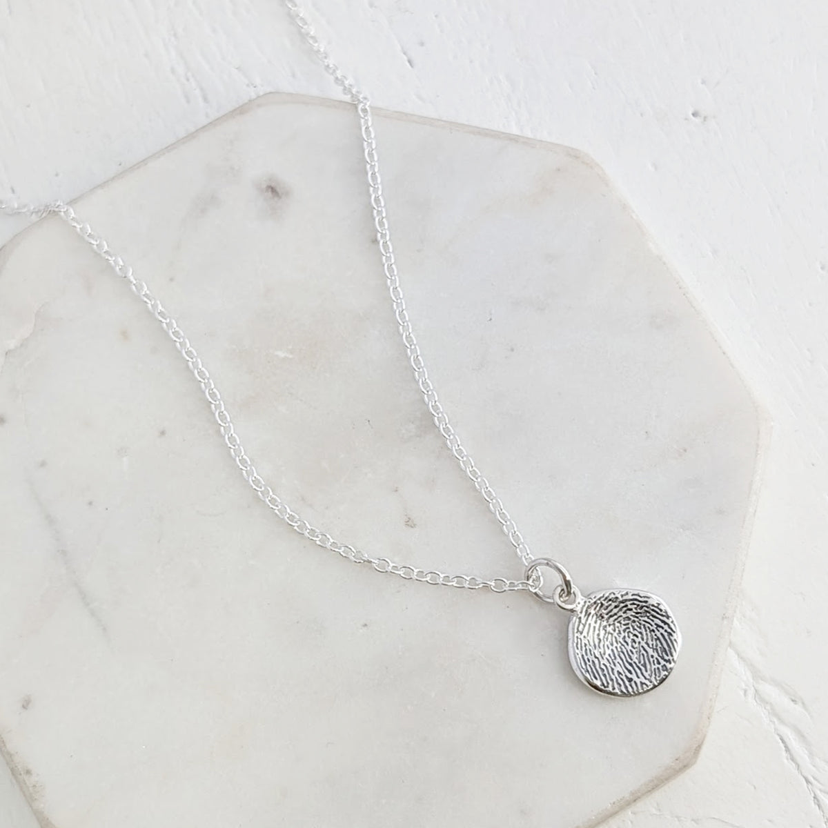 MOLTEN FINGERPRINT CHARM