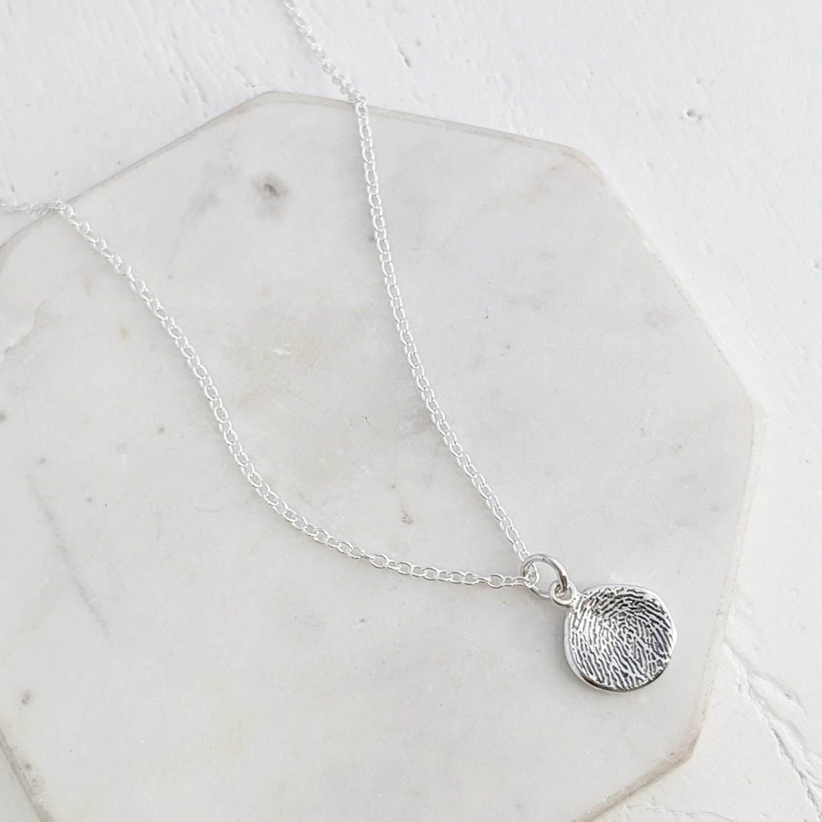 MOLTEN FINGERPRINT CHARM
