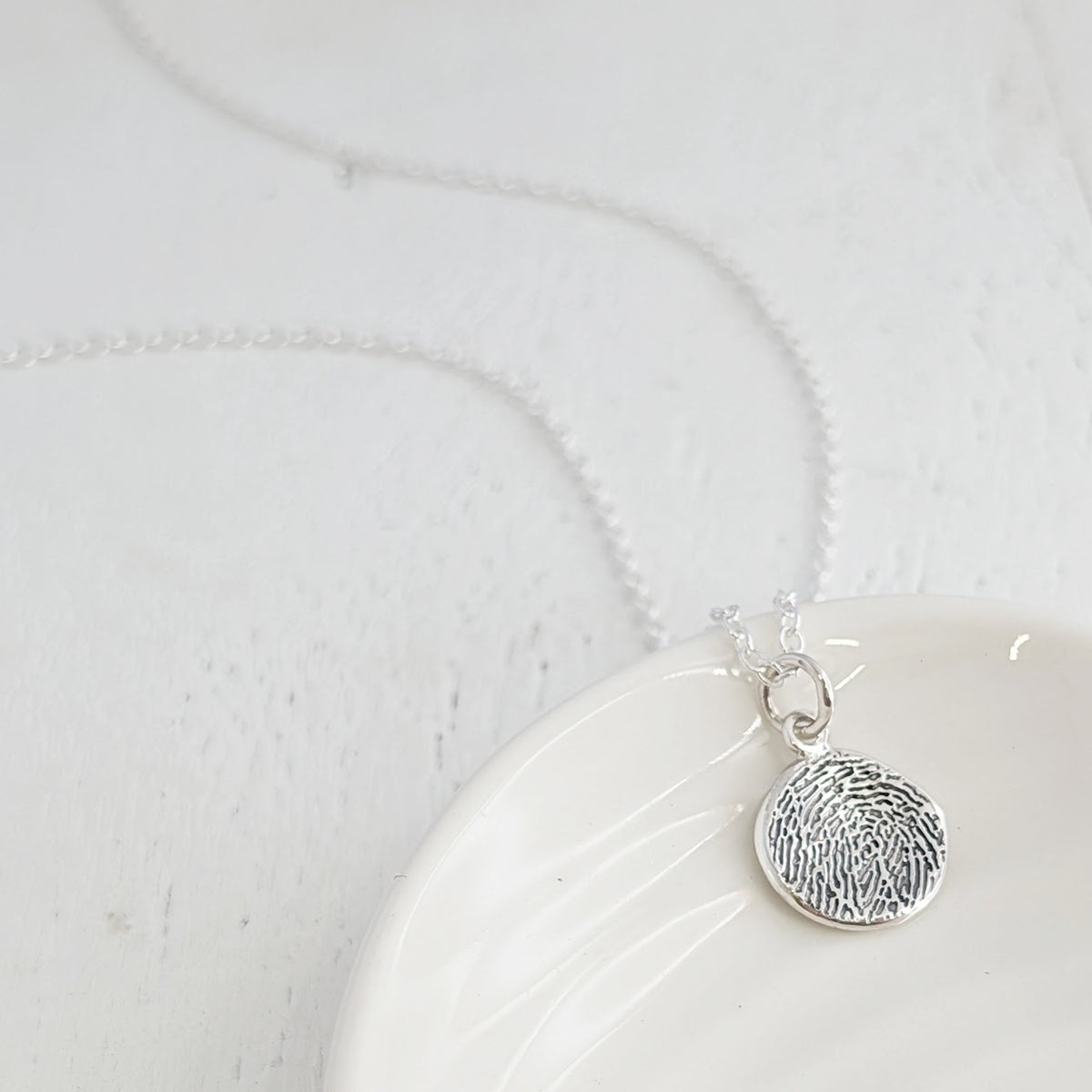 MOLTEN FINGERPRINT CHARM