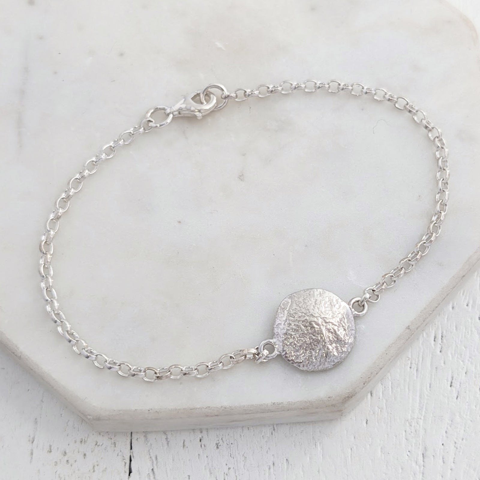 Molten fingerprint charm bracelelt handmade in sterling silver