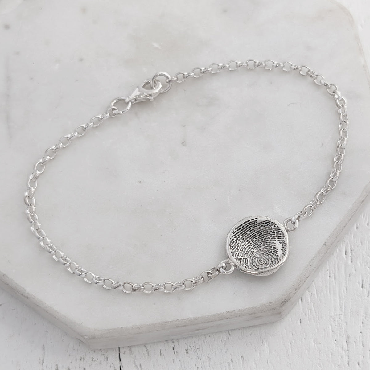 Molten fingerprint charm bracelelt handmade in sterling silver