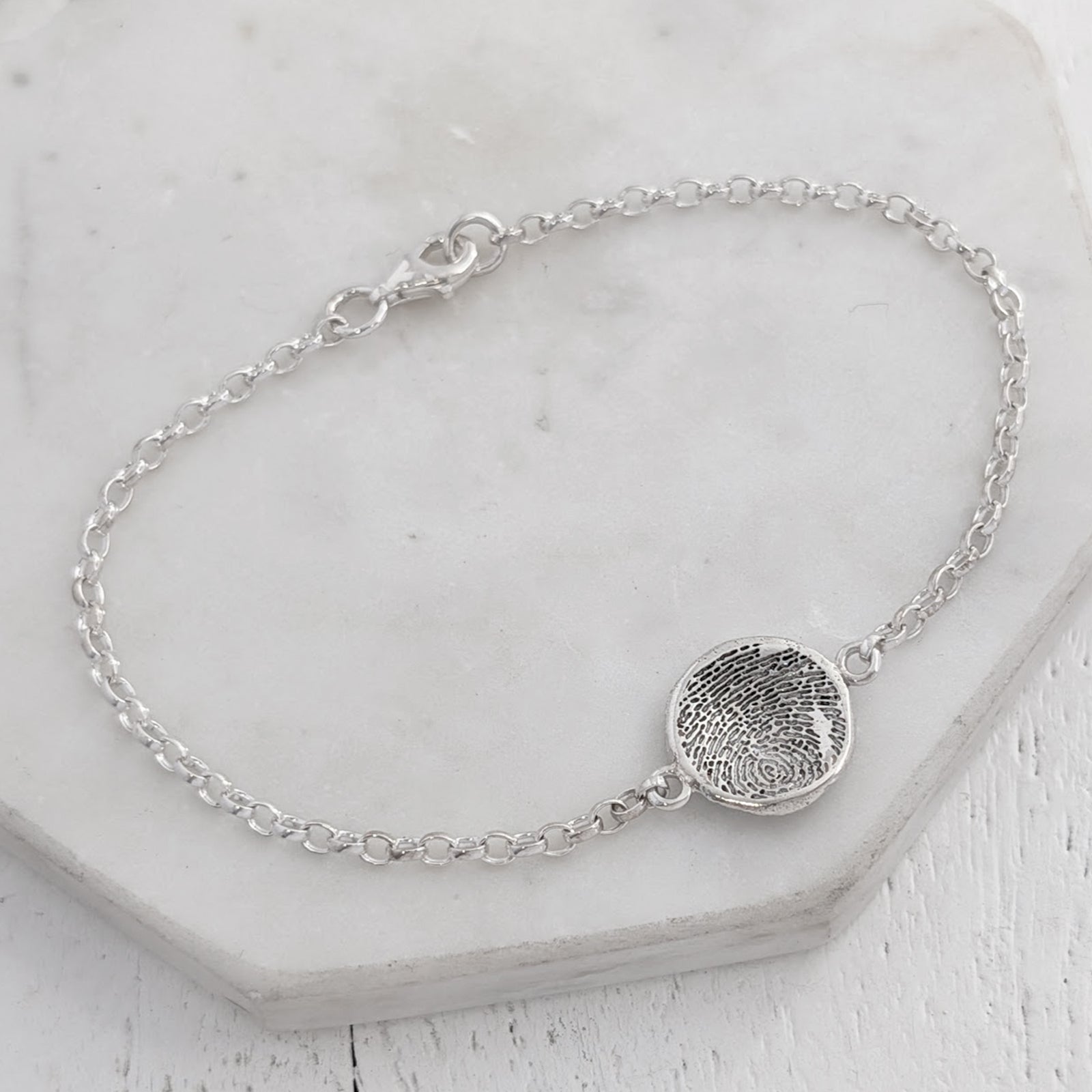 Molten fingerprint charm bracelelt handmade in sterling silver
