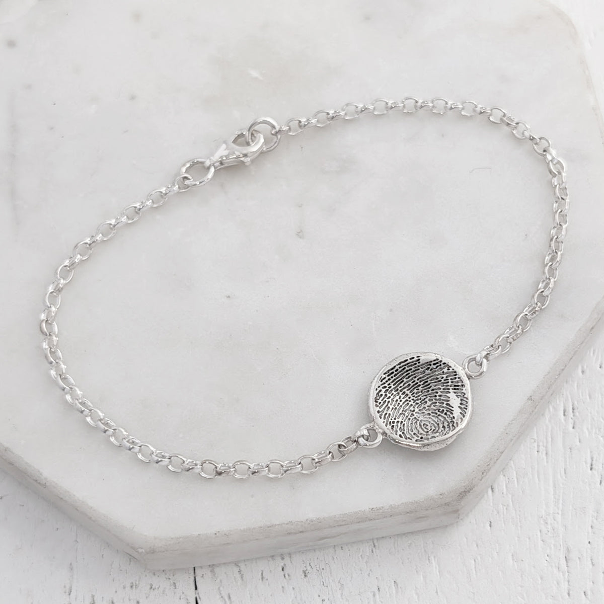 Molten fingerprint charm bracelelt handmade in sterling silver