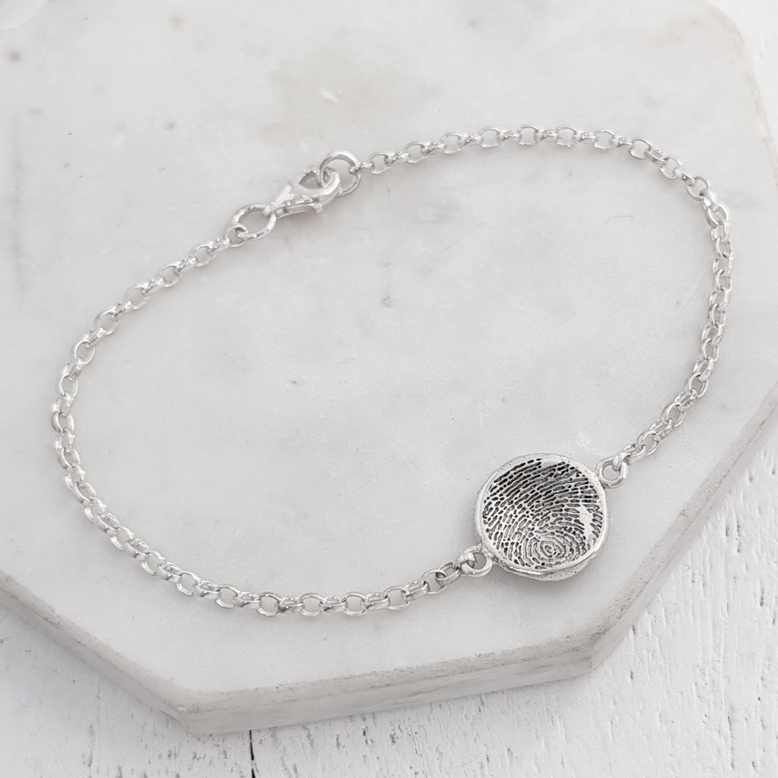 Molten fingerprint charm bracelelt handmade in sterling silver