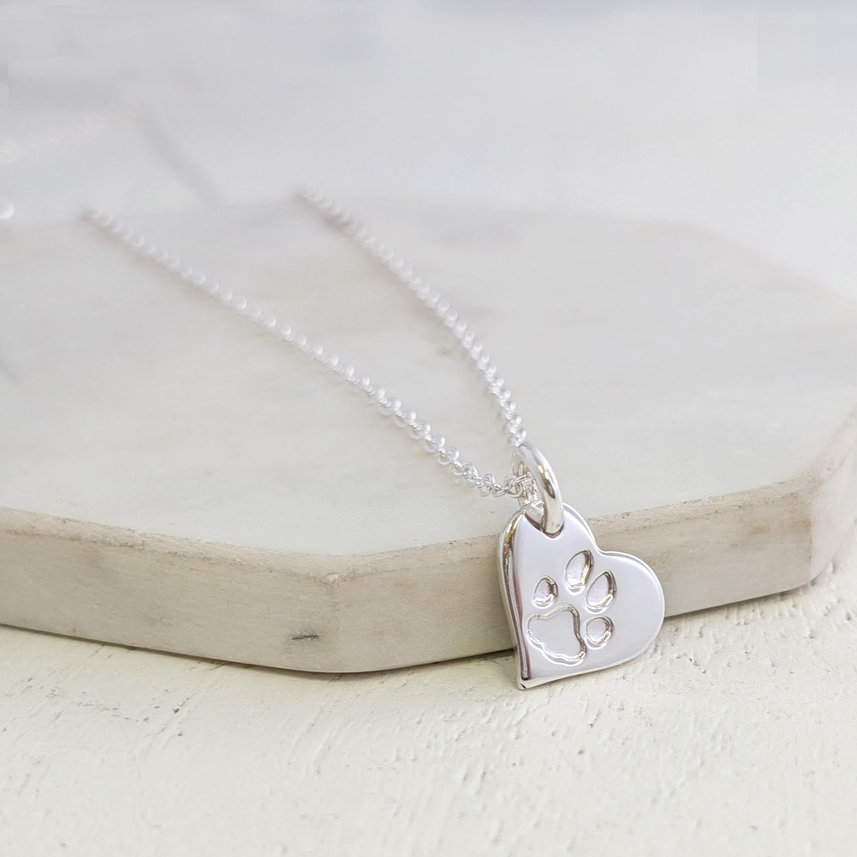 Sterling silver heart charm engraved with personalised pets pawprint
