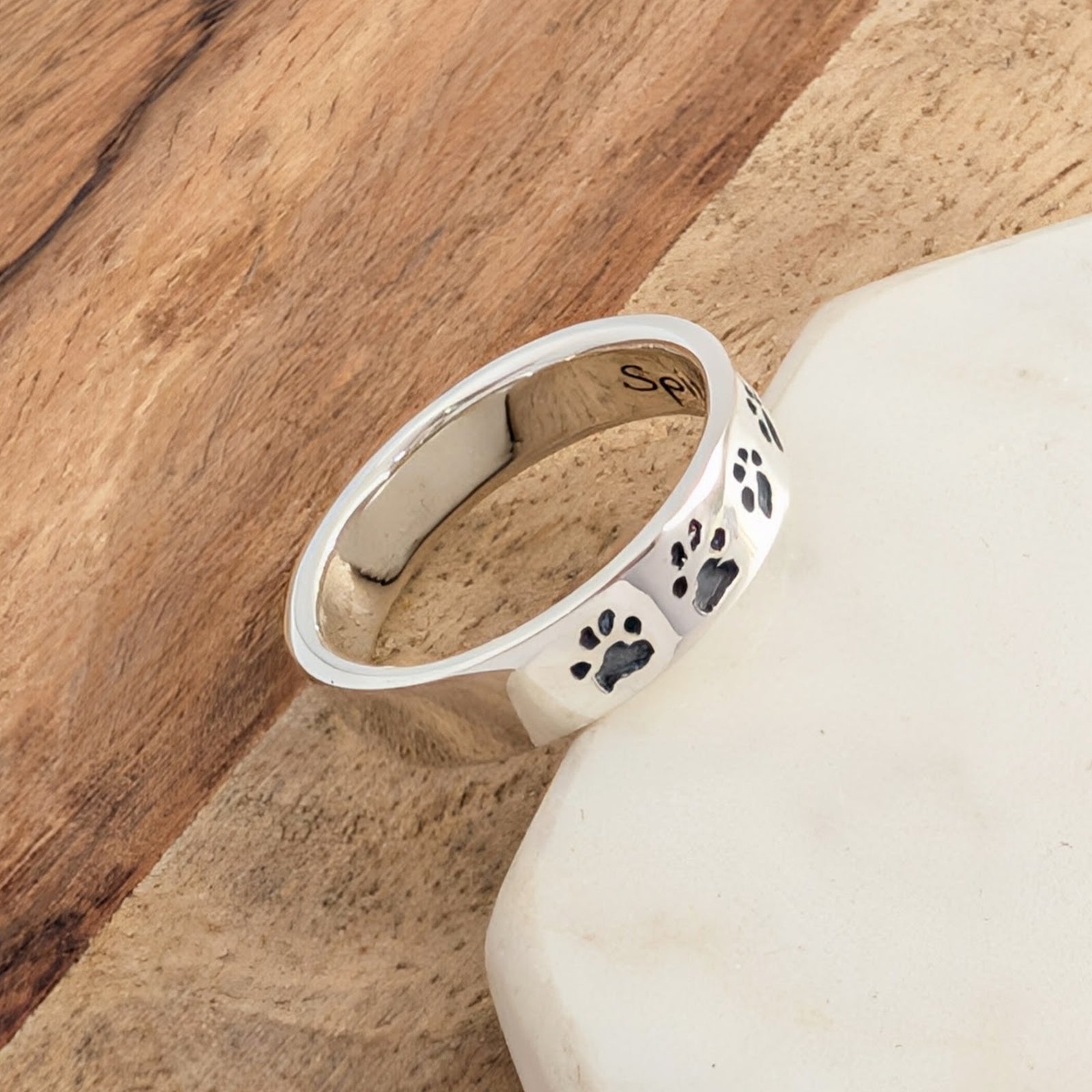 Custom Paw Print Jewellery Ring – Bespoke pet memorial ring personalised with real pawprints. Available in sterling silver or solid gold, creating a lasting tribute to a cherished companion.