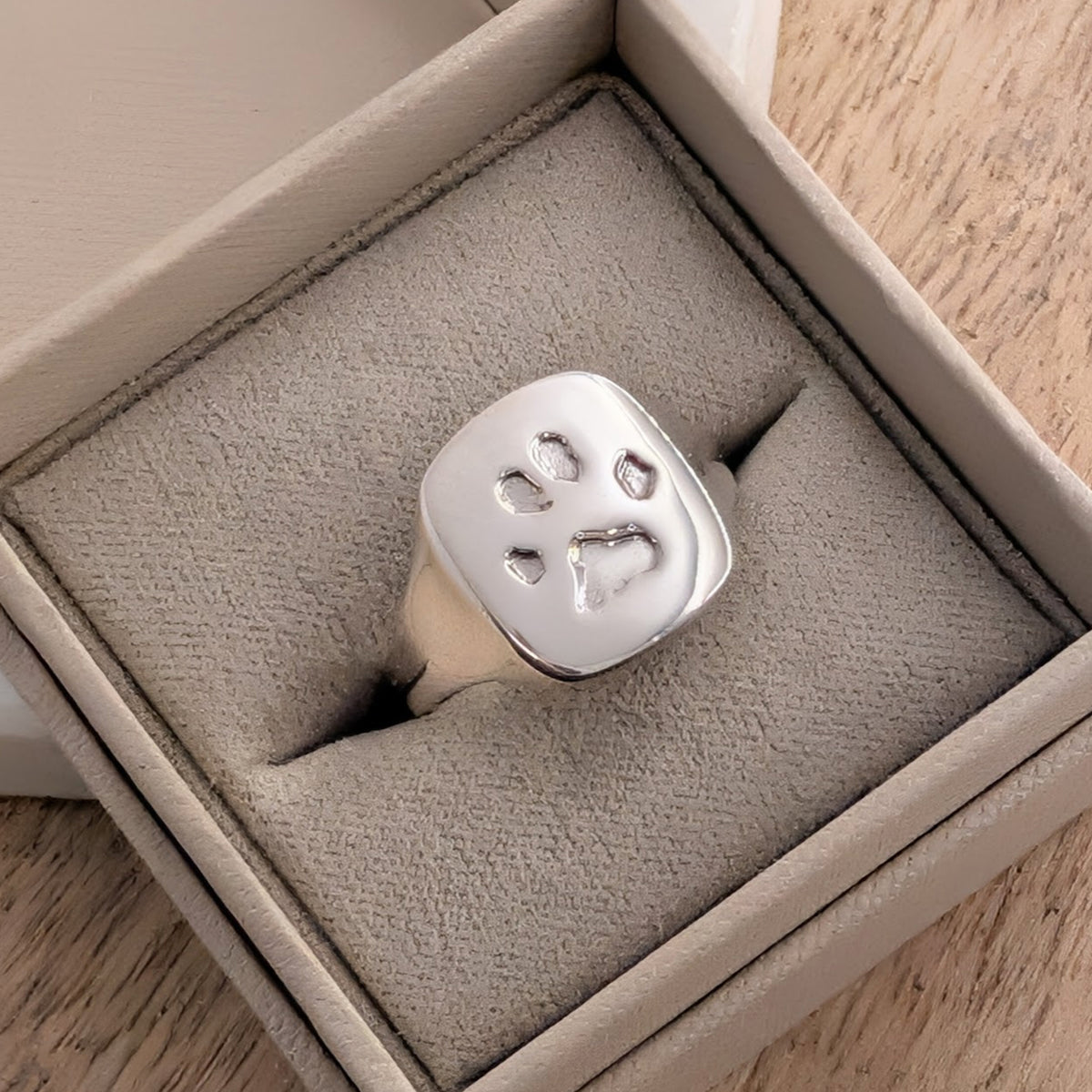 Sterling silver pet pawprint signet ring handmade by a Shropshire goldsmith, bespoke memorial jewellery for dogs and cats.