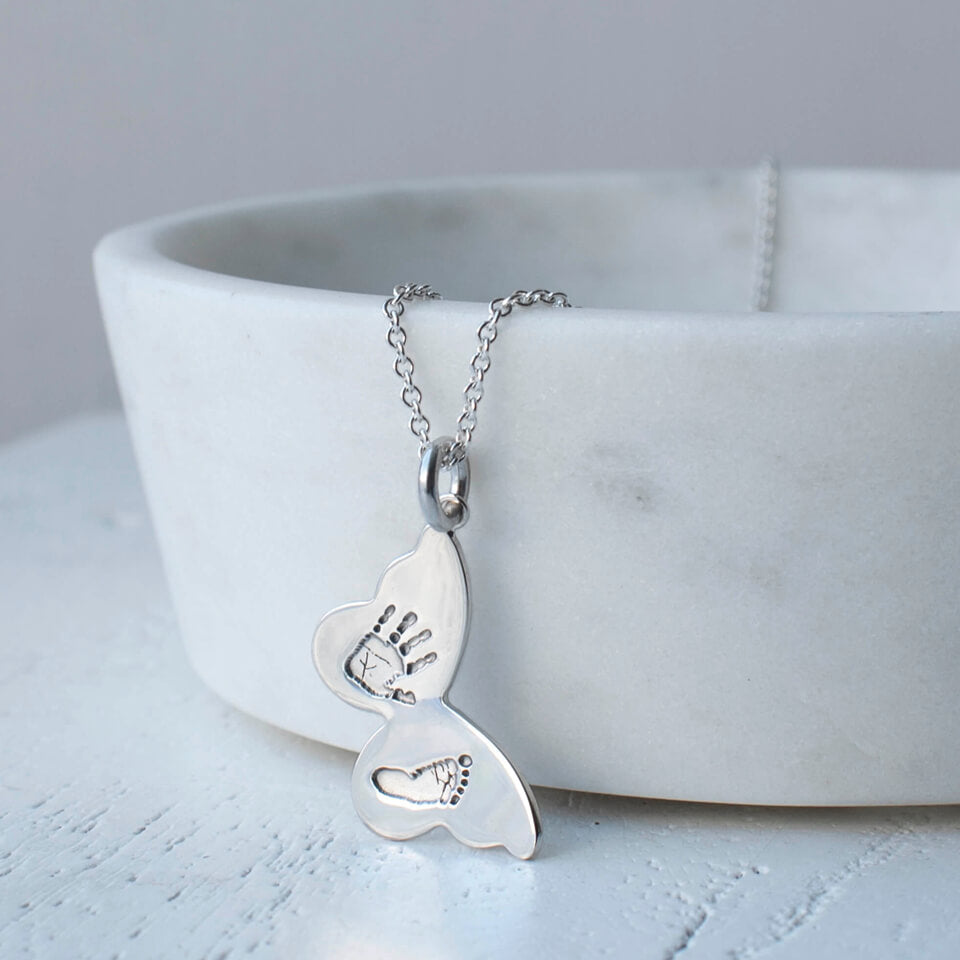 handprint and footprint butterfly necklace in silver and gold