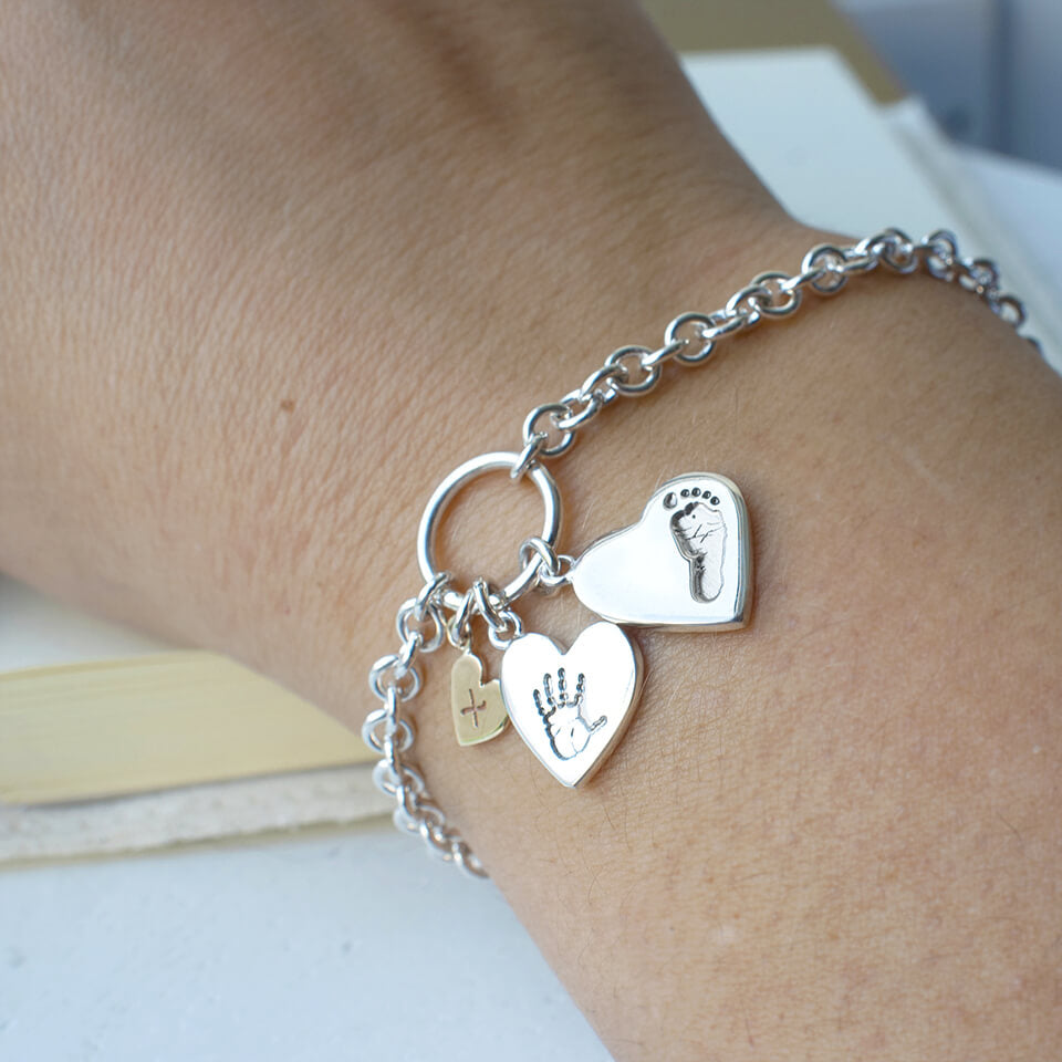 Baby handprint and footprint hugs and kisses charm bracelet in silver and gold