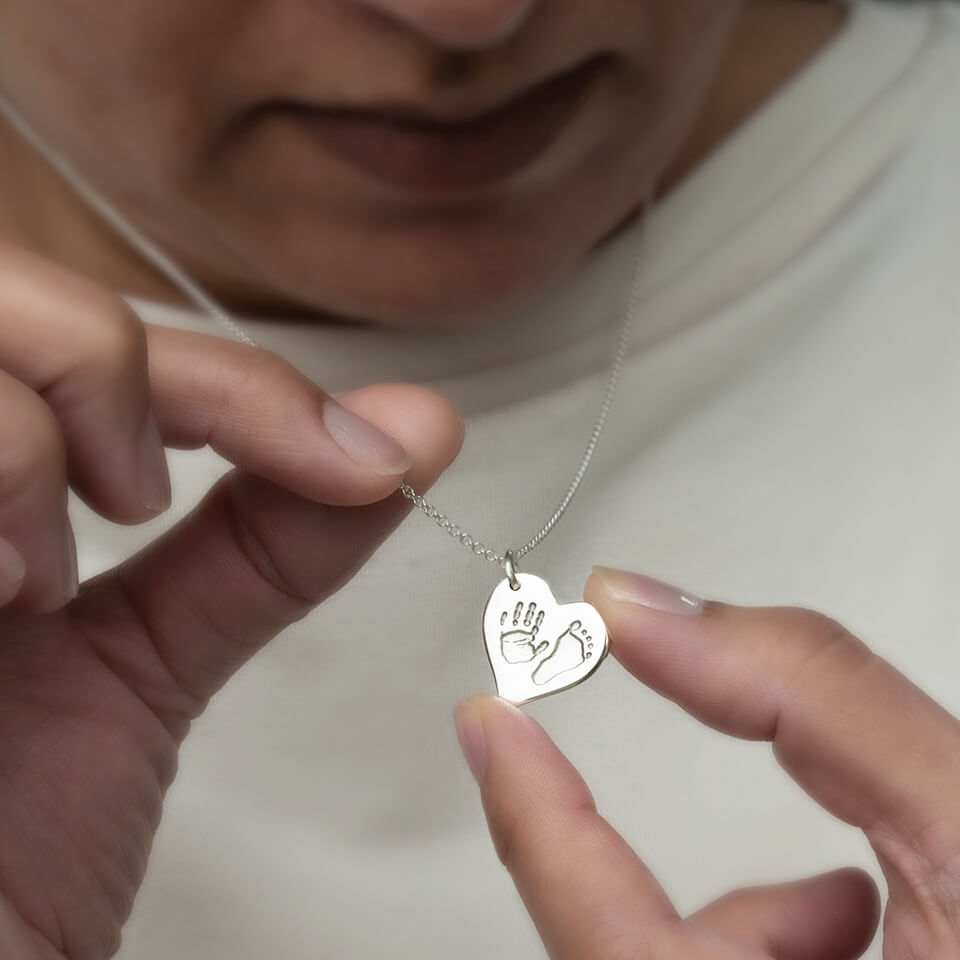 Handprint and footprint heart necklace