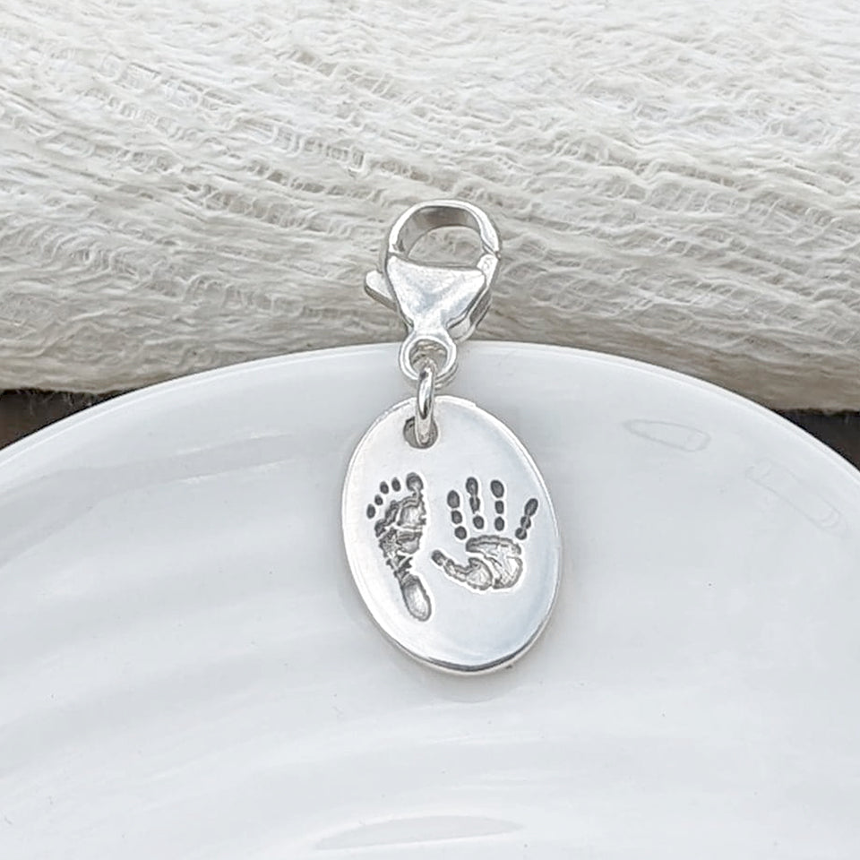 Child&#39;s Handprint and Footprint Oval Charm with clip to attach to bracelet