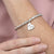 Baby handprint and footprint oval charm with silver sweetie bracelet